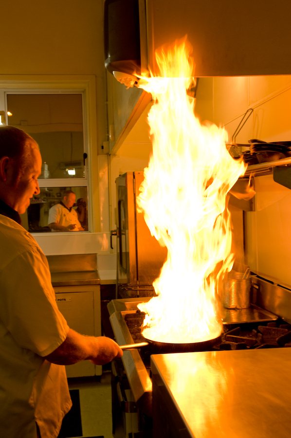 Chef and owner Andrew Poppelwell cooking at Design Cuisine, Napier